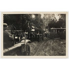 Немецкий солдат с трофейным советским ППШ в кабине тягача в составе колонны. Впереди легкий танк