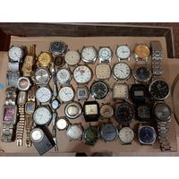 Куча часов на запчасти. задние крышки  не во всех часах есть.