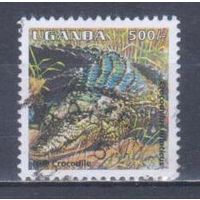 [903] Уганда 1995. Фауна.Рептилии.Крокодил. Гашеная марка.