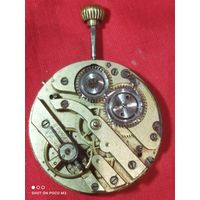 Механизм старых карманных часов и циферблат