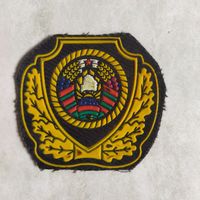 Кокарда пришивная на кепи сотрудника МВД Беларуси до 2014 года. Разновидность по штампу и расцветке.
