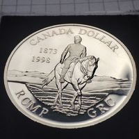 1 доллар Канады 1998 года. 125 лет Канадской королевской конной полиции . Серебро.