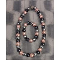 Новый комплект бижутерии: бусы 47 см и браслет (на резинке). Перламутр.