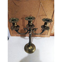 Старинный бронзовый подсвечник.