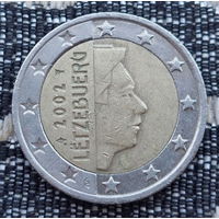 Люксембург 2 евро 2002 года. Король. Клеймо Гастауер-Клер Иветта. Лук со стрелой и звёздочкой и Посох Меркурия.