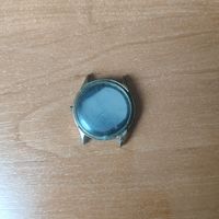 Корпус от часов в жёлтом металле, на крышке надпись времён посещения Биллом Клинтоном Беларуси.